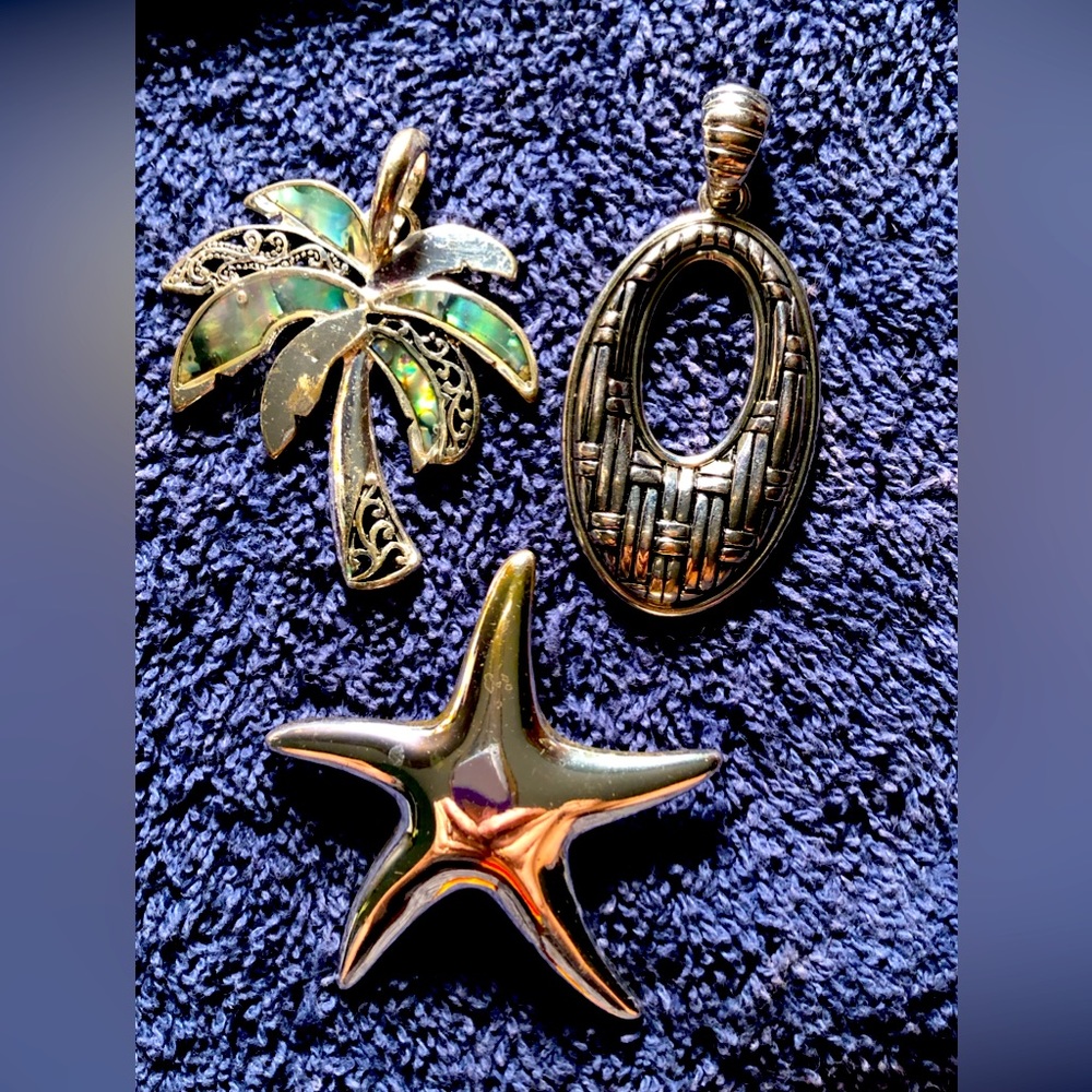 3 Silver tone pendants